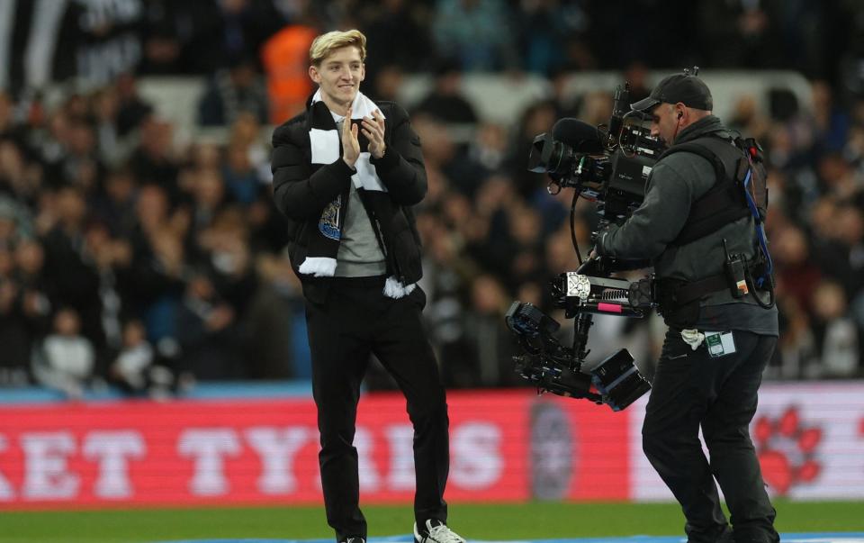 Anthony Gordon applauds fans as he is unveiled before the match - Lee Smith/Reuters