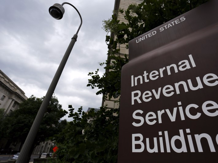 A security camera hangs near a corner of the U.S. Internal Revenue Service (IRS) building in Washington May 27, 2015. REUTERS/Jonathan Ernst