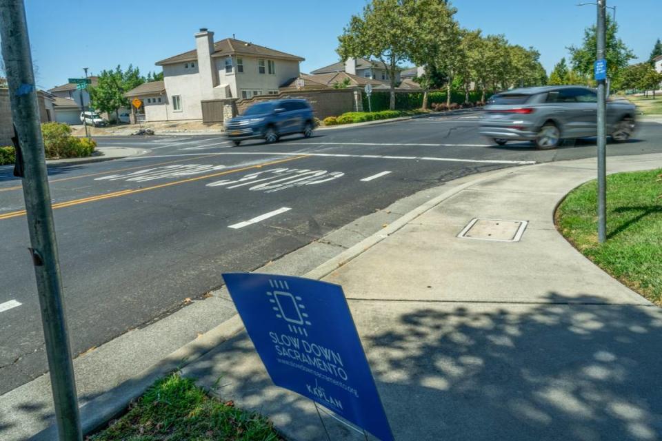 Several signs can be seen on July 8 urging motorists to slow down near the intersection of Club Center Drive and Banfield Drive where Sau Voong, 84, lost his life riding his bicycle when he was hit by a motorist June 11. The speed limit on Club Center, which winds through a residential neighborhood and past several parks, is 35 mph. 