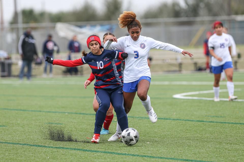 Veterans Memorial's Marissa Davis blocks Gregory-Portland's Khilyssa White during the District 29-5A game at Cabaniss Soccer Field, Friday, March 11, 2022, in Corpus Christi, Texas. The Wildcats defeated the Eagles, 2-0.