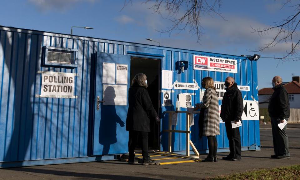 Members of the public arrive to cast their vote at a polling station during the Old Bexley and Sidcup by-election