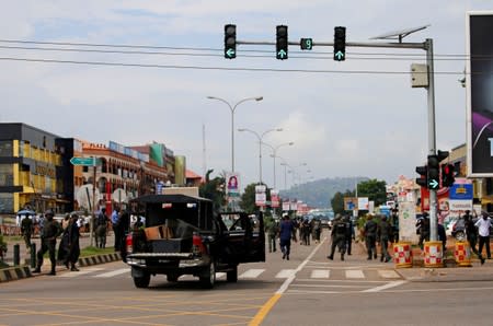 Some members of the police seen heading down Banex road during their operation to disperse members of the IMN from the street in Abuja