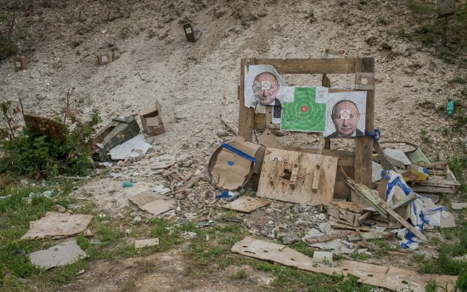 Pictures of Vladimir Putin are used for target practice at a combat training centre in eastern Ukraine