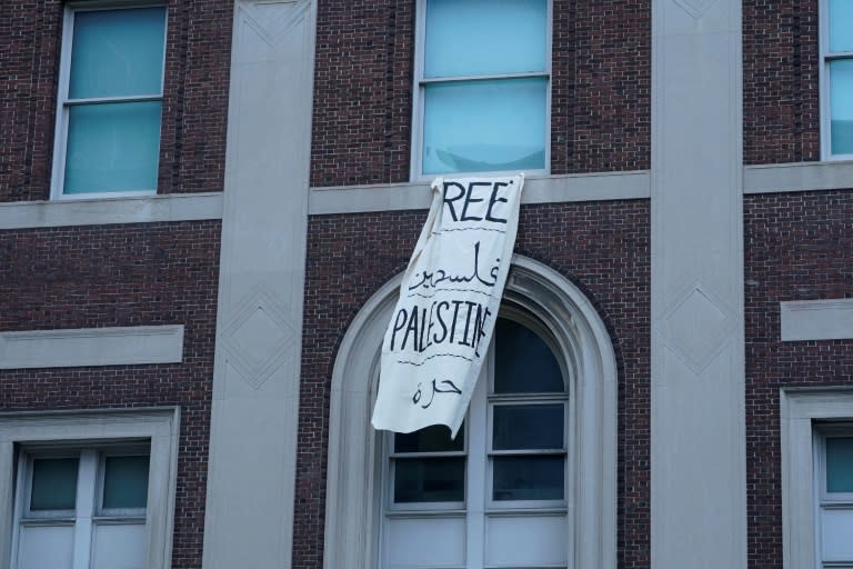 A 'Free Palestine' banner hangs on a Columbia University building on April 30, 2024 (TIMOTHY A. CLARY)