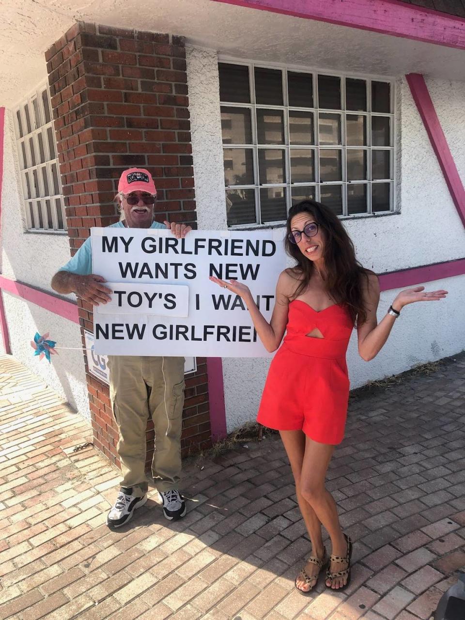 John Benton poses with his sign and an admirer in Cocoa Beach, F.L. this September The Florida man held a sign outside of the downtown Myrtle Beach Family Dollar on Oct. 10, 2023. Photo courtesy of John Benton.