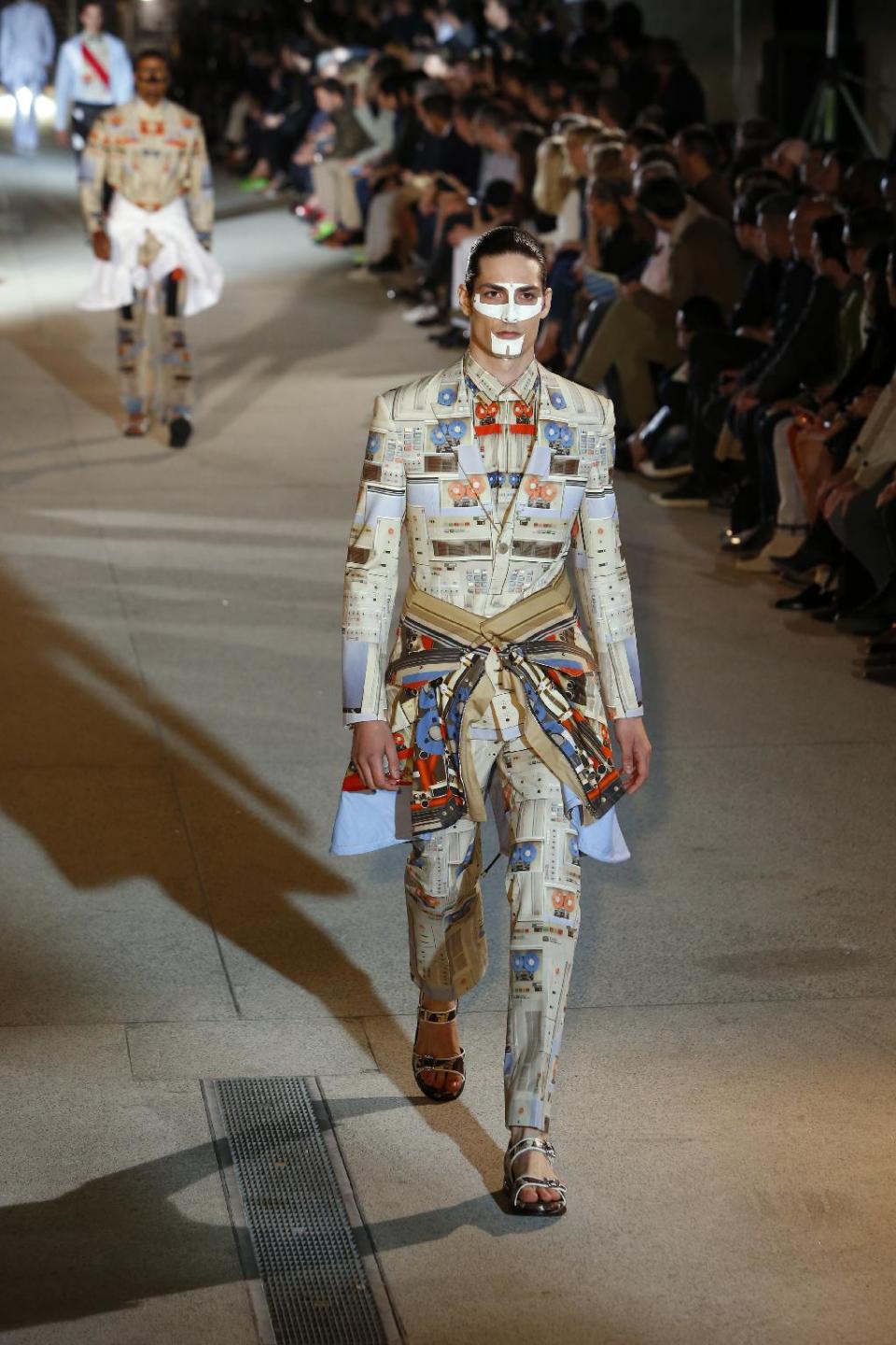 A model presents a creation as part of the Givenchy men's fashion Spring-Summer 2014 collection, presented Friday, June 28, 2013 in Paris. (AP Photo/Francois Mori)