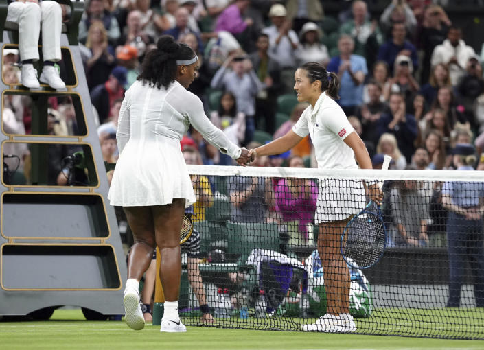 Serena Williams of the US greets France's Harmony Tan at the net after losing to her in a first round women’s singles match on day two of the Wimbledon tennis championships in London, Tuesday, June 28, 2022. (John Walton/PA via AP)