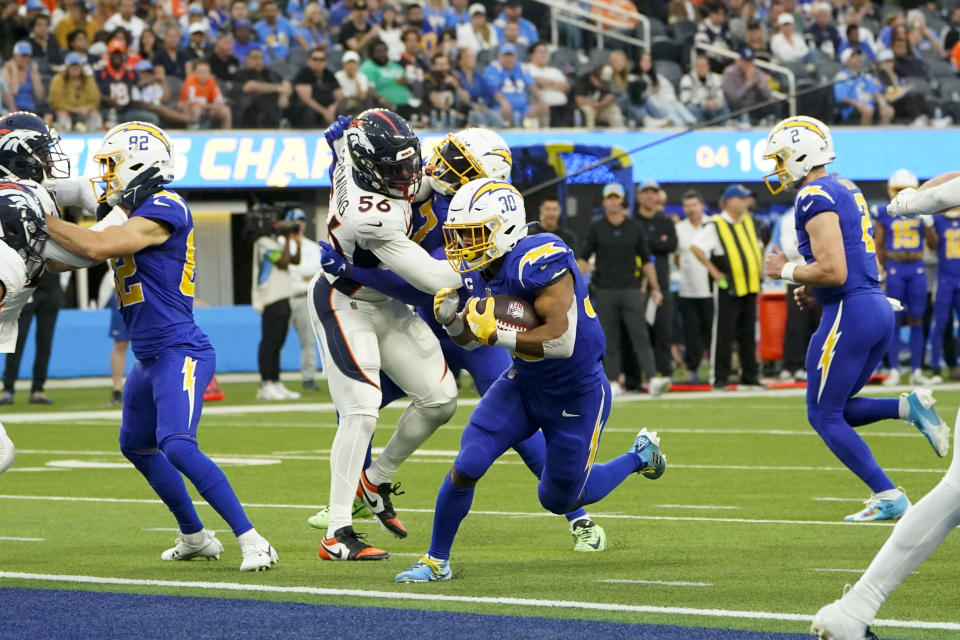 Los Angeles Chargers running back Austin Ekeler (30) enters the endzone for a touchdown during the second half of an NFL football game against the Denver Broncos Sunday, Dec. 10, 2023, in Inglewood, Calif. (AP Photo/Marcio Jose Sanchez)