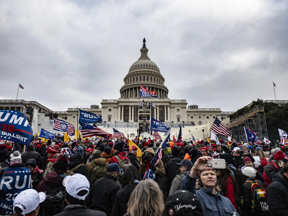 Supporters of then-President Donald Trump storm the Capitol (Samuel Corum / Getty Images file)