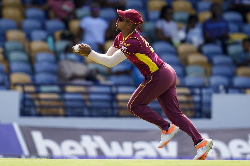 FILE - West Indies' captain Nicholas Pooran takes the catch to dismiss New Zealand's Finn Allen during the first ODI at Kensington Oval in Bridgetown, Barbados, Aug. 17, 2022. Pooran will lead his West Indies lineup out against Scotland in Hobart, capital of Australia's southern island state, in Group B on Monday, Oct. 17, 2022, the same day defending champion Australia has a scheduled practice match against India, the inaugural champions in 2007. (AP Photo/Ramon Espinosa, File)