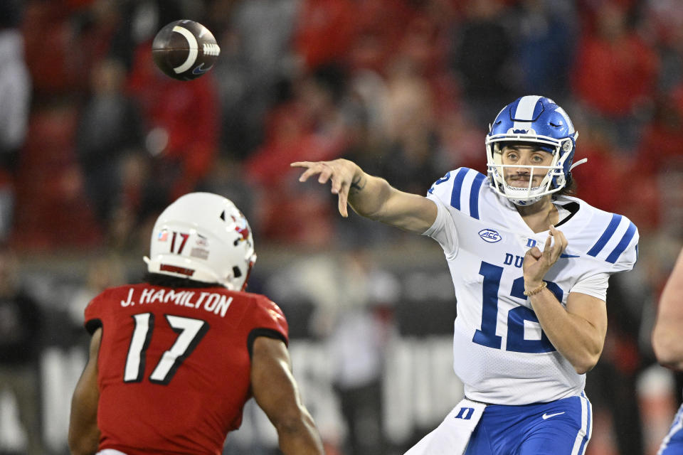 Oct 28, 2023; Louisville, Kentucky, USA; Duke Blue Devils quarterback Grayson Loftis (12) throws a pass over <a class="link " href="https://sports.yahoo.com/ncaaf/teams/louisville/" data-i13n="sec:content-canvas;subsec:anchor_text;elm:context_link" data-ylk="slk:Louisville Cardinals;sec:content-canvas;subsec:anchor_text;elm:context_link;itc:0">Louisville Cardinals</a> linebacker Jackson Hamilton (17) during the second half at L&N Federal Credit Union Stadium. Louisville defeated Duke 23-0. Mandatory Credit: Jamie Rhodes-USA TODAY Sports