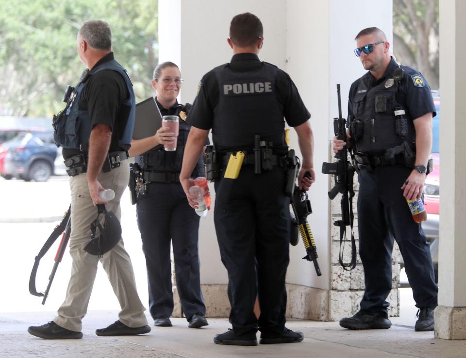 Ormond Beach police officers stand by during the protest, Saturday, April 22, 2023, at Ormond Beach City Hall. The neo-Nazi group that planned the protest never showed up.