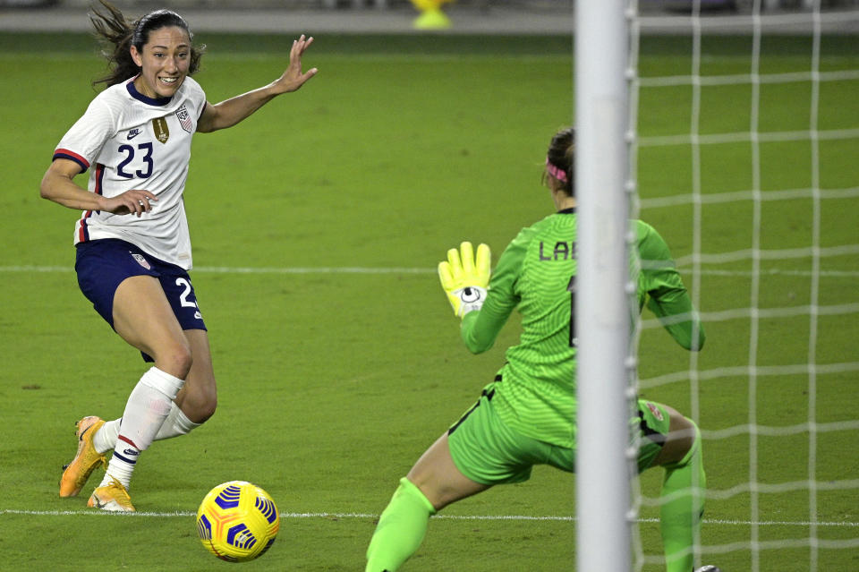 United States forward Christen Press (23) attempts a shot that is blocked by Canada goalkeeper Stephanie Labbe (1) during the second half of a SheBelieves Cup women's soccer match, Thursday, Feb. 18, 2021, in Orlando, Fla. (AP Photo/Phelan M. Ebenhack)