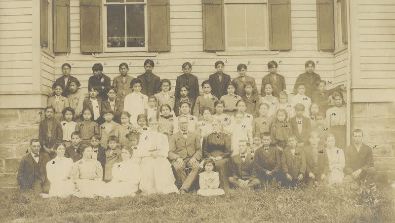 In this photo taken in 1906, provided by the Quaker and Special Collections at Haverford College, teachers and students gather for a portrait at Tunesassa School in Tunesassa, New York. The National Native American Boarding School Healing Coalition says it will digitize 20,000 archival pages related to Quaker-operated Indian boarding schools. The records will provide a better understanding of the conditions that children received at these schools.