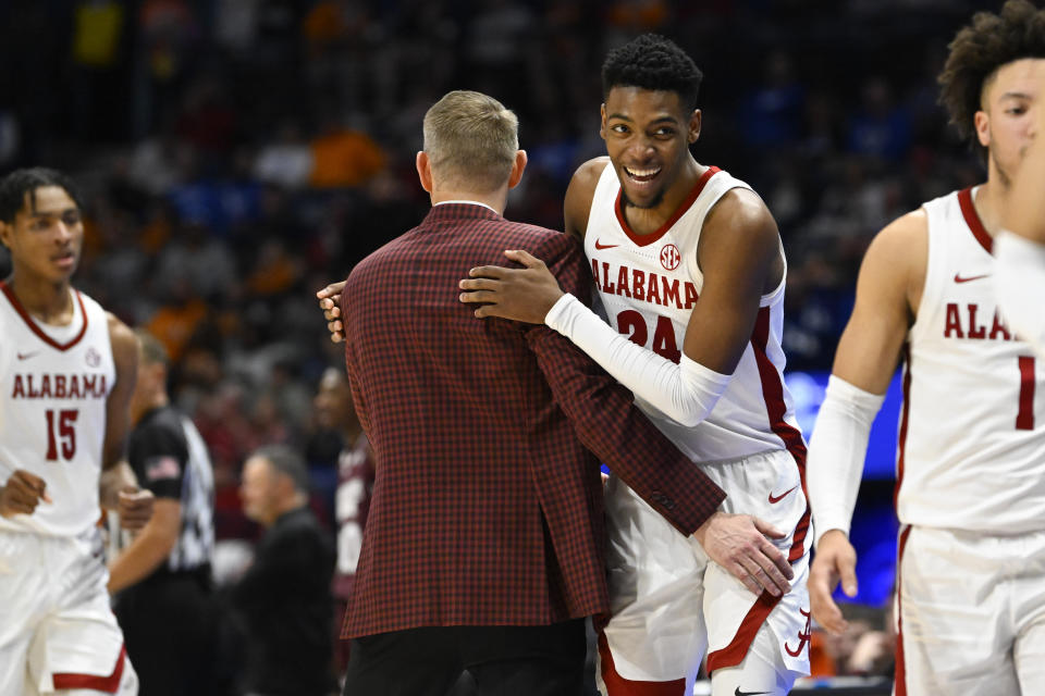 Alabama forward Brandon Miller (24) is congratulated by coach Nate Oats as he is taken out in the closing moments of the second half of an NCAA college basketball game against Mississippi State in the quarterfinals of the Southeastern Conference Tournament, Friday, March 10, 2023, in Nashville, Tenn. Alabama won 72-49. (AP Photo/John Amis)
