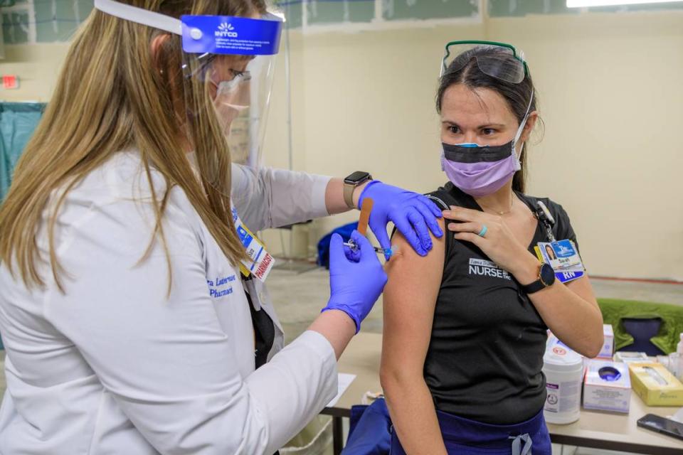 Sarah Kiehl, an ICU nurse at Truman Medical Centers/University Health, was the first health care worker there to receive the new coronavirus vaccine in December 2020. The health system gave employees until Sept. 20 to get vaccinated or lose their jobs. Fewer than 40 employees resigned instead of taking the shots.