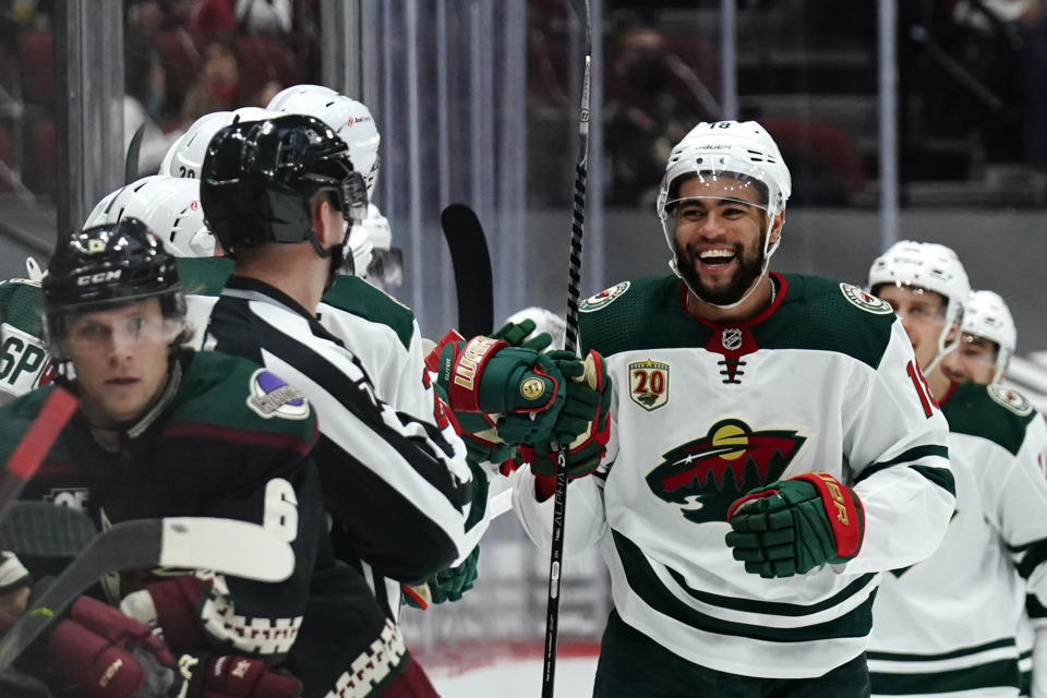 Minnesota Wild left wing Jordan Greenway (18) celebrates after scoring a goal against the Arizona Coyotes during the second period of an NHL hockey game Friday, March 5, 2021, in Glendale, Ariz. (AP Photo/Rick Scuteri)