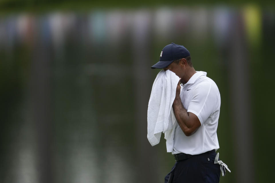 Tiger Woods wipes his face on the 16th hole during the first round of the Masters golf tournament at Augusta National Golf Club on Thursday, April 6, 2023, in Augusta, Ga. (AP Photo/Matt Slocum)