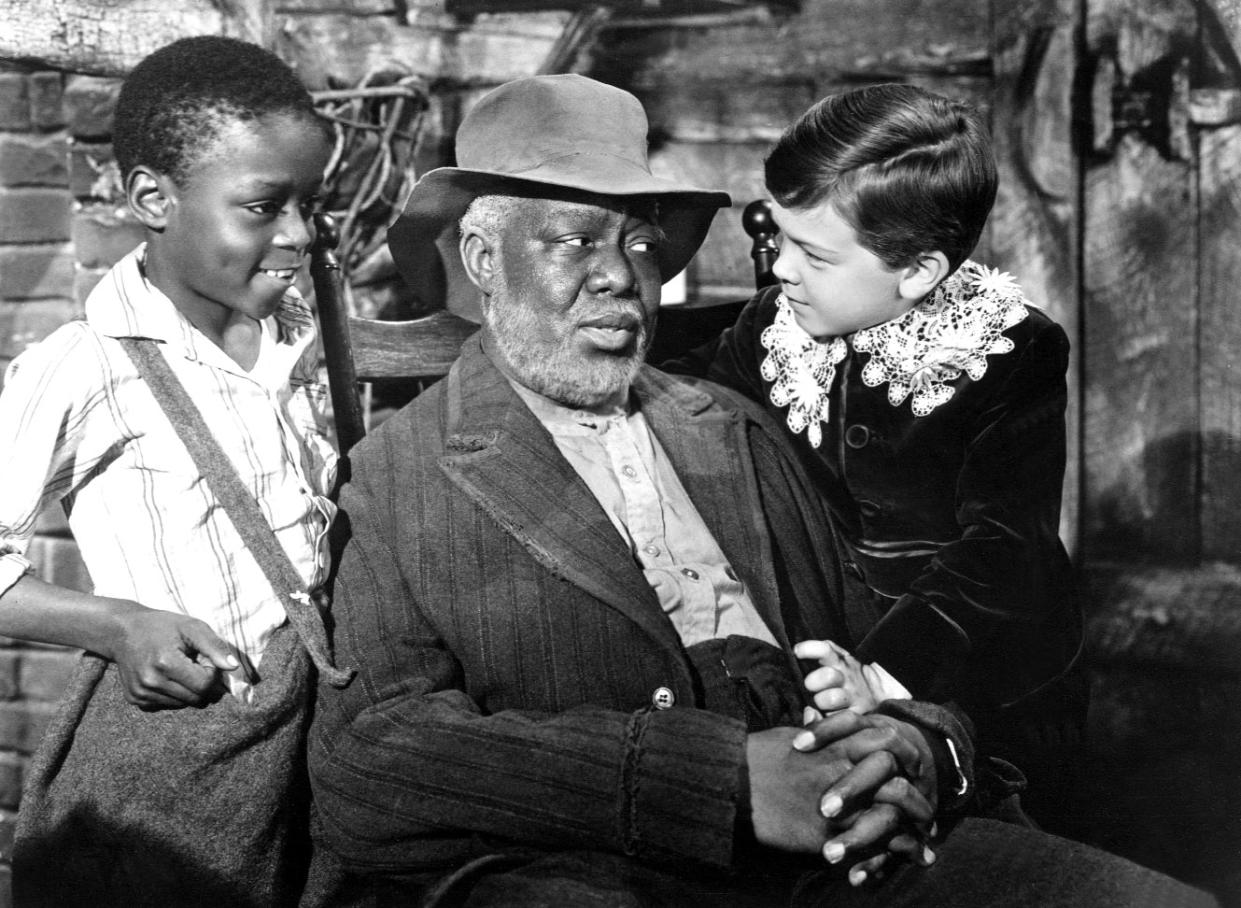 Toby (Glen Leedy), Uncle Remus (James Baskett) and Johnny (Bobby Driscoll) in Song of the South. (Courtesy Everett Collection)