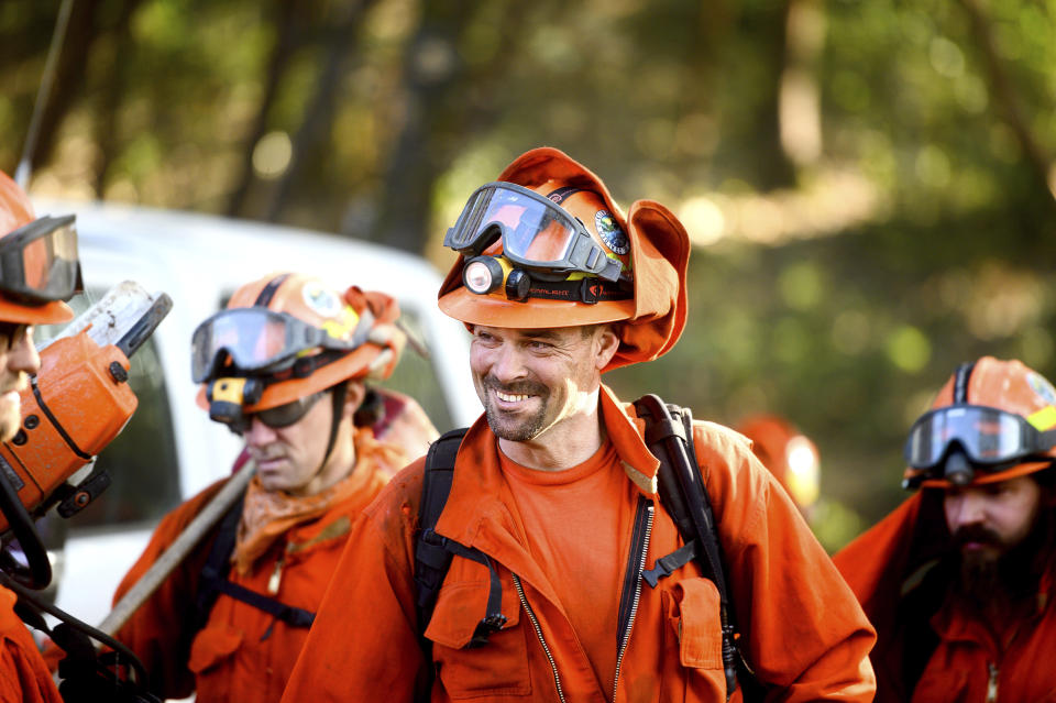 Inmate firefighters prepare to battle the Kincade Fire near Healdsburg, Calif., on Tuesday, Oct. 29, 2019. The overall weather picture in northern areas is improving, as powerful, dry winds bring extreme fire weather to Southern California. (AP Photo/Noah Berger)
