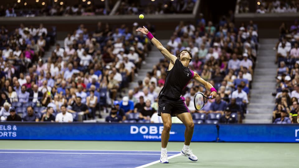 Shelton prepares to hit a serve at last year's US Open. - On