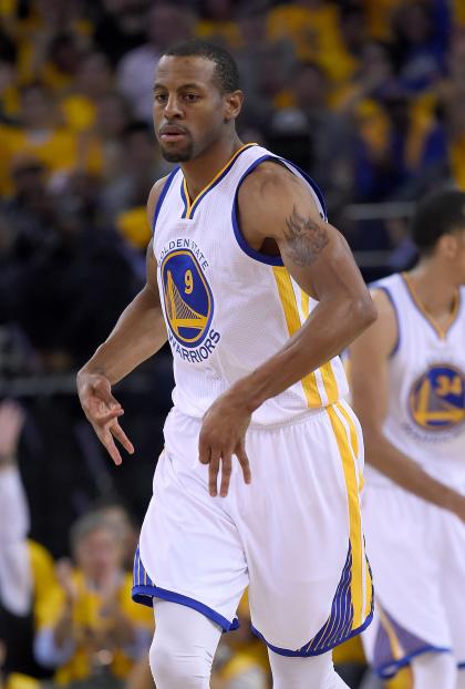 OAKLAND, CA - MAY 13:  Andre Iguodala #9 of the Golden State Warriors reacts after making a three-point shot against the Memphis Grizzlies during Game Five of the Western Conference Semifinals of the NBA Playoffs at ORACLE Arena on May 13, 2015 in Oakland, California. NOTE TO USER: User expressly acknowledges and agrees that, by downloading and or using this photograph, User is consenting to the terms and conditions of the Getty Images License Agreement.  (Photo by Thearon W. Henderson/Getty Images)