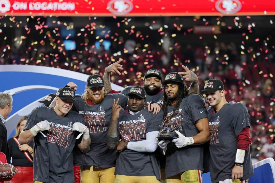 Jan 28, 2024; Santa Clara, California, USA; (Left to right) San Francisco 49ers running back Christian McCaffrey (23), tight end George Kittle (85), offensive tackle Trent Williams (71), wide receiver Deebo Samuel (19), and linebacker Fred Warner (54), and quarterback Brock Purdy (13) celebrate after winning the NFC Championship football game against the Detroit Lions at Levi's Stadium. Mandatory Credit: Kyle Terada-USA TODAY Sports