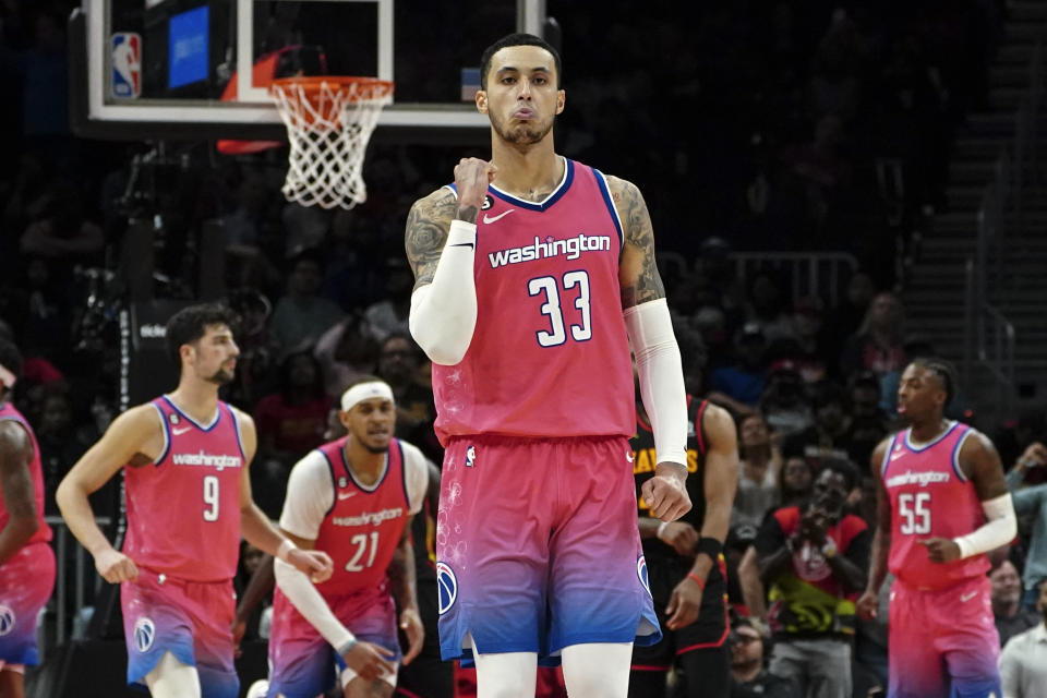 Washington Wizards forward Kyle Kuzma (33) reacts after a basket late in the second half of an NBA basketball game against the Atlanta Hawks Tuesday, Feb. 28, 2023, in Atlanta. (AP Photo/John Bazemore)