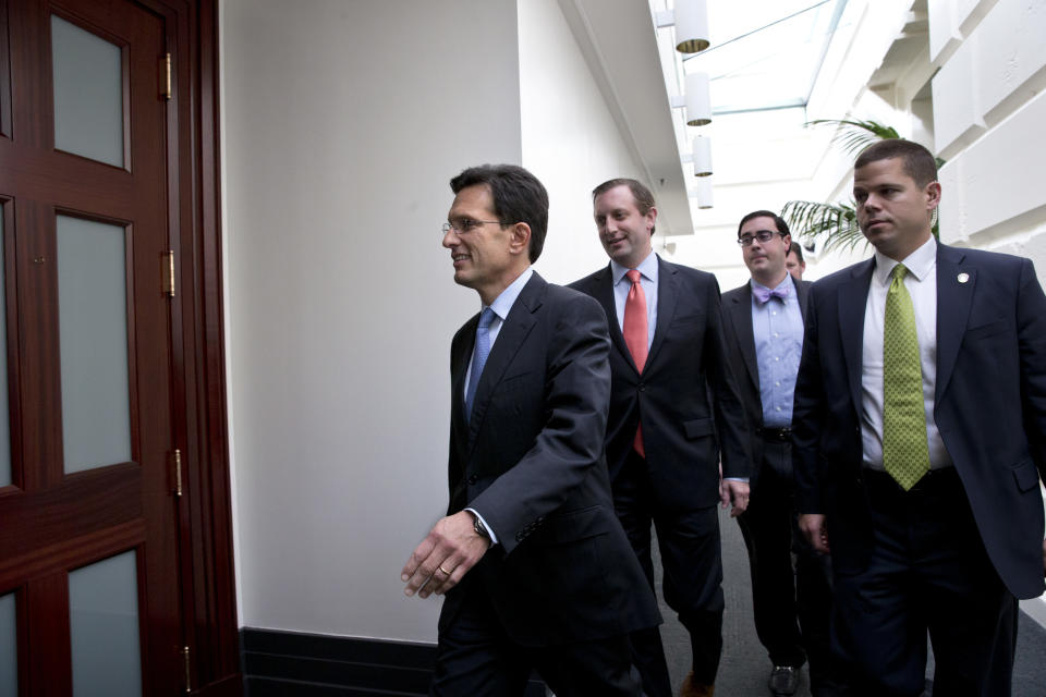 House Majority Leader Eric Cantor, R-Va., arrives for a meeting with House Republicans after Senate leaders reached a last-minute agreement Wednesday to avert a threatened Treasury default and reopen the government after a partial, 16-day shutdown, at the Capitol in Washington, Wednesday, Oct. 16, 2013. (AP Photo/J. Scott Applewhite)