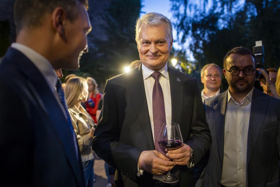 Lithuania's President Gitanas Nauseda, a presidential candidate, celebrates winning the second round of Lithuania's presidential election, in Vilnius, Lithuania, late Sunday, May 26, 2024. (AP Photo/Mindaugas Kulbis)