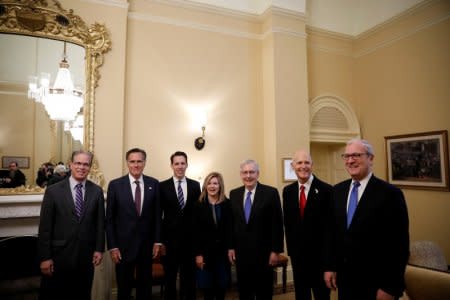 Senate Majority Leader Mitch McConnell poses with newly elected Senators, Mike Braun of Indiana, Mitt Romney of Utah, Josh Hawley of Missouri, Rep. Marsha Blackburn of Tennessee, Gov. Rick Scott of Florida and Rep. Kevin Cramer of North Dakota at the U.S. Capitol in Washington, U.S., November 14, 2018. REUTERS/Aaron P. Bernstein