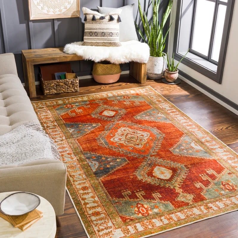 The rug over a wood floor in a room