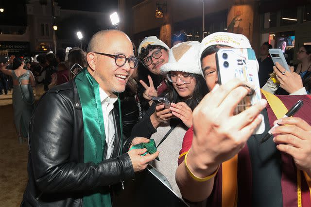 <p>Charley Gallay/Getty Images</p> James Sie poses with fans at the Netflix premiere of 'Avatar: The Last Airbender'