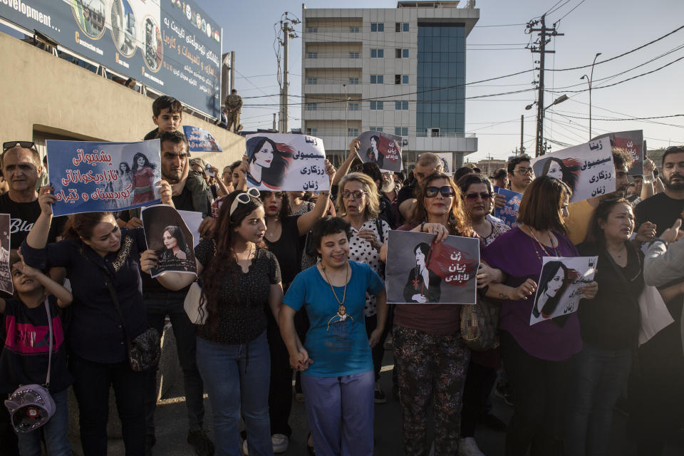 Protesters gather in Sulaimaniyah on Sept. 28, 2022, protest the killing of Mahsa Amini, an Iranian Kurdish woman after she was arrested in Tehran by morality police for wearing her headscarf improperly. Iran has accused Kurdish opposition groups in exile of orchestrating the wave of protests across the country over the past two weeks. But Kurdish activists say the government is just trying to scapegoat them to distract from the domestic anger fueling the unrest. (AP Photo/Hawre Khalid, Metrography)