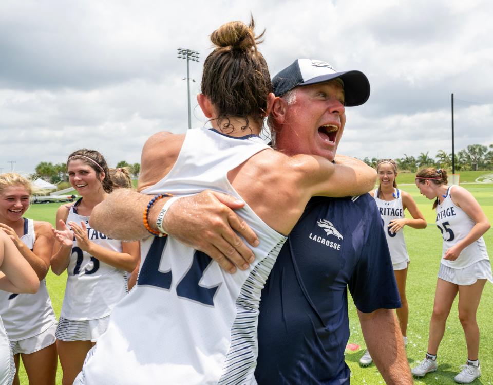 American Heritage head coach John McClain celebrates with Caroline Byrd after winning the Class 1A state championship over Lake Highland Prep during their game in Naples on Saturday, May 11, 2024. Photo by Darron R, Silva/Special to USA Today Network-Florida