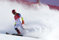 Mikaela Shiffrin of United States looks down after skiing off course during the first run of the women's giant slalom at the 2022 Winter Olympics, Monday, Feb. 7, 2022, in the Yanqing district of Beijing. (AP Photo/Robert F. Bukaty)