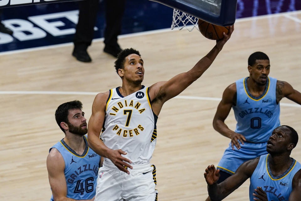 Indiana Pacers guard Malcolm Brogdon (7) shoots in front of Memphis Grizzlies guard John Konchar (46) during the second half of an NBA basketball game in Indianapolis, Tuesday, Feb. 2, 2021. (AP Photo/Michael Conroy)