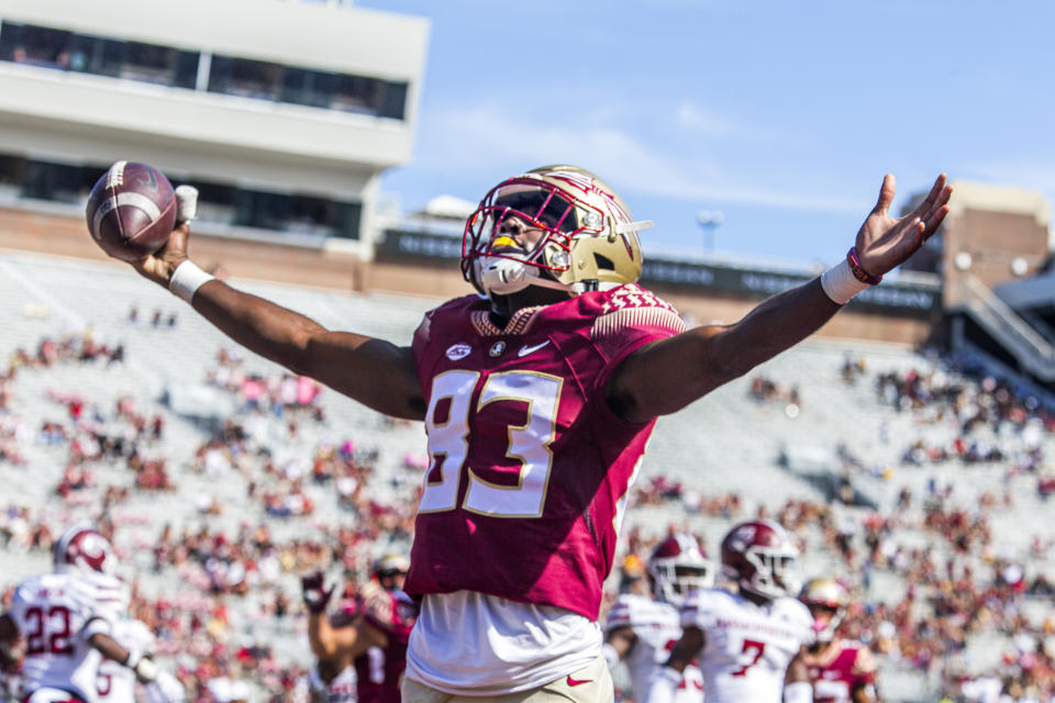 Florida State wide receiver Jordan Young (83) celebrates a touchdown in the second half of an NCAA college football game against Massachusetts in Tallahassee, Fla., Saturday, Oct. 23, 2021. Florida State defeated UMass 59-3. (AP Photo/Mark Wallheiser)