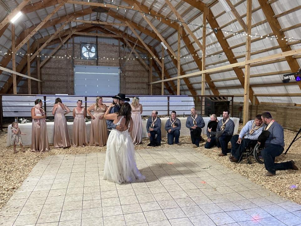 After the wedding party arrived in a livestock trailer, the wedding reception for Erin Hogan and Travis Brown was held in a barn in Sturgis, S.D.