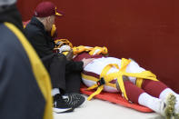 Washington Football Team tight end Ricky Seals-Jones (83) is carted off the field in a stretcher after colliding with a camera during the first half of an NFL football game against the Philadelphia Eagles, Sunday, Jan. 2, 2022, in Landover, Md. (AP Photo/Mark Tenally)