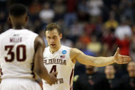 NASHVILLE, TN - MARCH 16: Deividas Dulkys #4 of the Florida State Seminoles high-fives Ian Miller #30 after a play against the St. Bonaventure Bonnies during the second round of the 2012 NCAA Men's Basketball Tournament at Bridgestone Arena on March 16, 2012 in Nashville, Tennessee. (Photo by Jamie Squire/Getty Images)