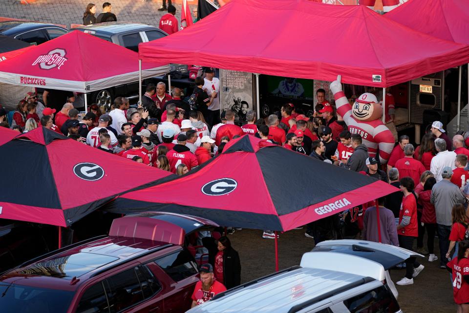 Dec 31, 2022; Atlanta, Georgia, USA; Ohio State Buckeyes and Georgia Bulldogs fans tailgate prior to the Peach Bowl in the College Football Playoff semifinal at Mercedes-Benz Stadium. Mandatory Credit: Adam Cairns-The Columbus Dispatch
Ncaa Football Peach Bowl Ohio State At Georgia