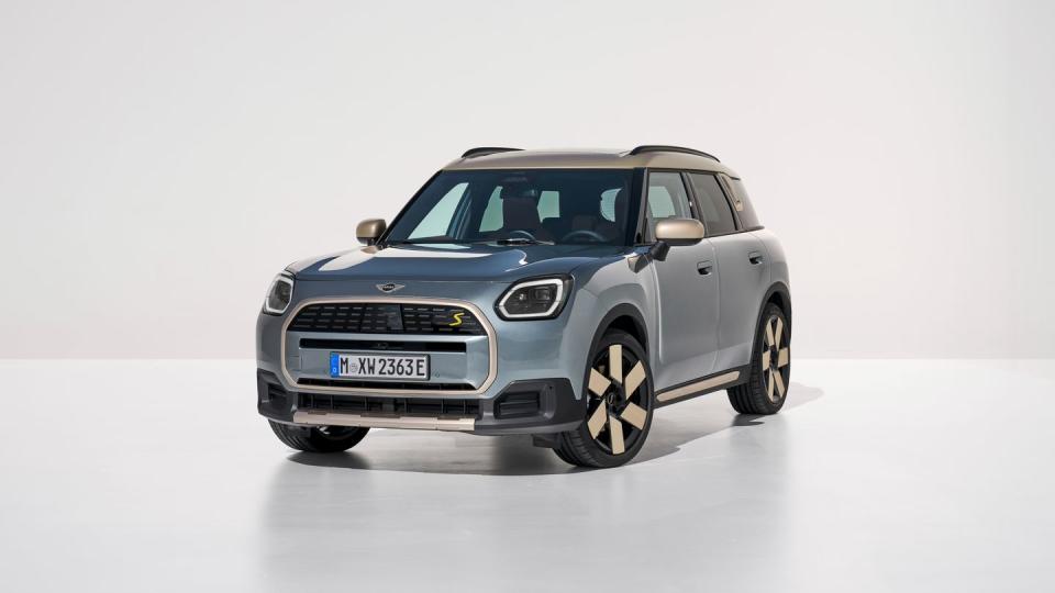 2025 mini cooper countryman electric in light blue with a cream and black interior