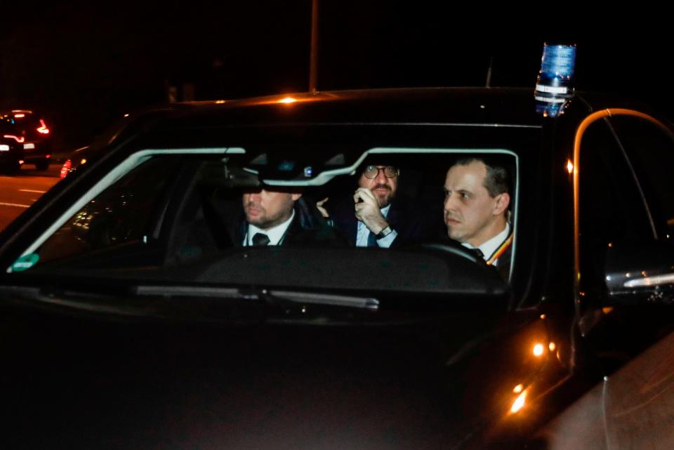 Belgian Prime Minister Charles Michel, centre, arrives at the Royal Castle of Laeken in Brussels to offer the resignation of his government (AFP/Getty Images)