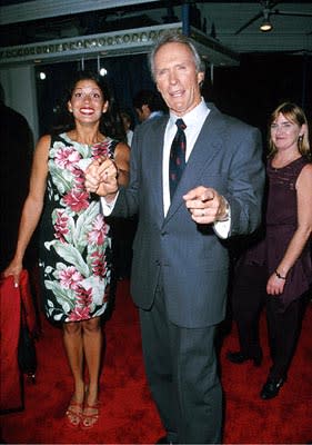 Clint Eastwood points out the guy that just slipped an ice cube down the back of his wife's dress at the Mann's Village Theatre premiere of Warner Brothers' Space Cowboys