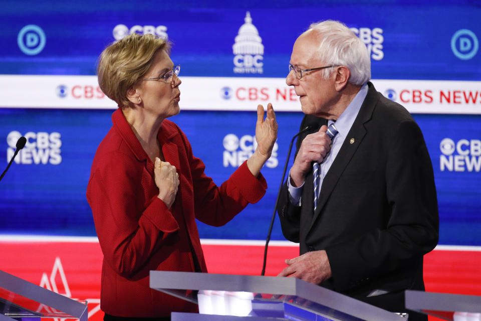 From left, Democratic presidential candidates, Sen. Elizabeth Warren, D-Mass., left, talks with Sen. Bernie Sanders, I-Vt., right, on stage after the Democratic presidential primary debate at the Gaillard Center, Tuesday, Feb. 25, 2020, in Charleston, S.C., co-hosted by CBS News and the Congressional Black Caucus Institute. (AP Photo/Patrick Semansky)