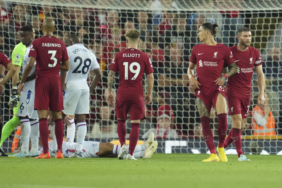 Liverpool's Darwin Nunez, second right, gestures after he was shown a red card during the English Premier League soccer match between Liverpool and Crystal Palace at Anfield stadium in Liverpool, England, Monday, Aug. 15, 2022. (AP Photo/Jon Super)