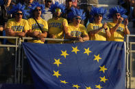European fan on the 1st tee ahead of the morning Foursomes matches at the Ryder Cup golf tournament at the Marco Simone Golf Club in Guidonia Montecelio, Italy, Saturday, Sept. 30, 2023. (AP Photo/Andrew Medichini)