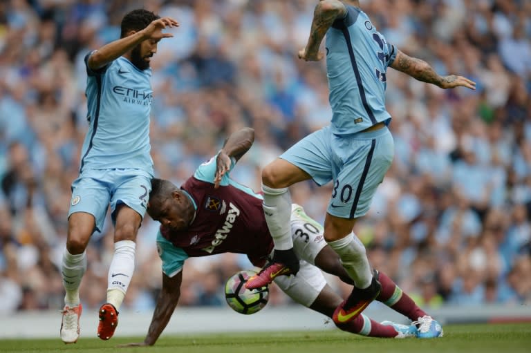 West Ham United's midfielder Michail Antonio (C) clashes with Manchester City's defenders Nicolas Otamendi and Gael Clichy (L) on August 28, 2016