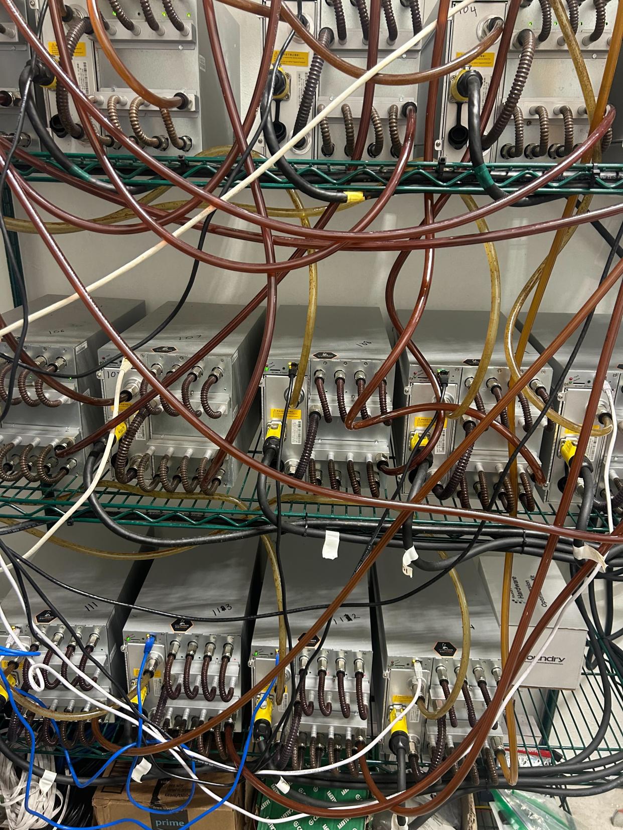 Bitcoin mining computers at Bathhouse Flatiron in New York City, which heat the facility's pools. <span class="copyright">Andrew R. Chow</span>